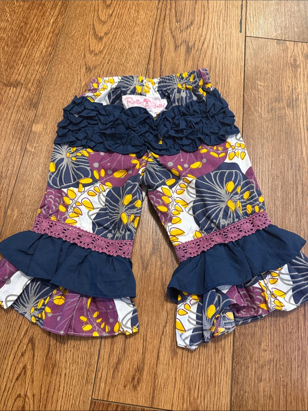Ruffle Butts Navy, Purple & Yellow Floral Ruffle Pants 6-12 months